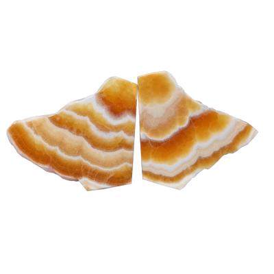 China Wholesale Natural Orange Calcite Slate from Donghai Form Healing Stones Calcite Rock Palm Slice Crystal Gold Silk Frozen Stones for sale