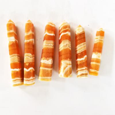 China Wholesale Natural Orange Stone Yellow Gold Stone Pyramid Calcite Point Donghai Calcite Stones Frozen Silk Magic Wand Pillars Healing Tower for sale