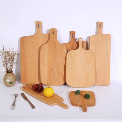 China Low MOQ Sustainable Beech Cutting Board Organic Solid Wood Kitchen Chopper For Pizza Bread for sale