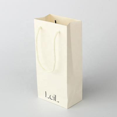 China Jewelry Packaging Custom Printing Beige White Paper Bag With Cotton Handle for sale