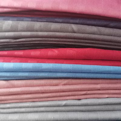 China Polyester Shrink-Resistant Woven Fabric 100% Sheer Color Broadcloth Fabric Stripe Embossed Color Dyed Fabric for sale