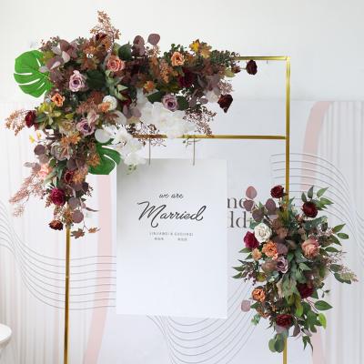 China Handcrafted Wedding Silk Flowers Triangle Arch Backdrop Wedding Reception Flower Wall Hanging Decoration Antique Flower Arrangement for sale