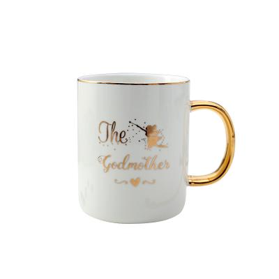 China Sustainable Creative Design Gold Printing Ceramic Mugs With Spoon for sale