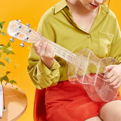 China Wholesale Lightness Ukulele 21 Inch Ukelele Soprano String Guitar Mini Concert Carbon Fiber Plastic Ukulele Guitalele Musical Instruments for sale