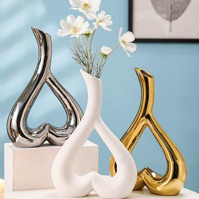 China Europe Gold Hollow Circular Ceramic Flower Vase Decor Gold Vases Centerpiece Small Mouth Vases Gold Nordic Decorative Tabletop Decor for sale