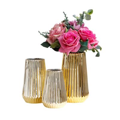 China Europe Gold Hollow Circular Ceramic Flower Vase Decor Gold Vases Centerpiece Small Mouth Vases Gold Nordic Decorative Tabletop Decor for sale