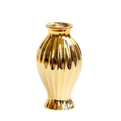 China Europe Gold Hollow Circular Ceramic Flower Vase Decor Gold Vases Centerpiece Small Mouth Vases Gold Nordic Decorative Tabletop Decor for sale