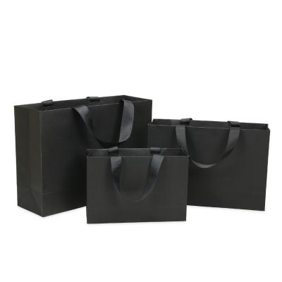 China Custom Printed Luxury Black Recycled Materials Factory Logo Shoes Clothes Packing Paper Bags for sale