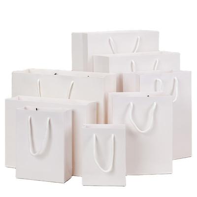 China Recycled Materials Wholesale Shoes Custom Apparel White Wholesale Paper Bags With Handle for sale