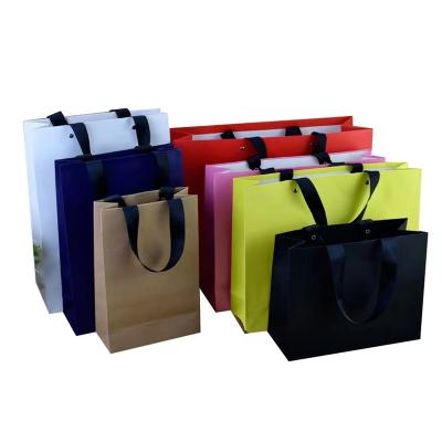 China Recycled Materials Printed Logo Custom Paper Bags Recyclable Clothing Gift Shopping Bag for sale