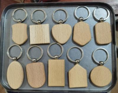 China 10styles beech wood key chain wholesale custom laser engraving pure wooden key chain wood key chain for sale