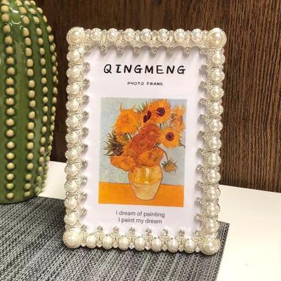 China Alloy Light luxury white pearl photo frame can be hung on the wall simple 6/7/8/10 inch desktop display table graduation photo frame for sale