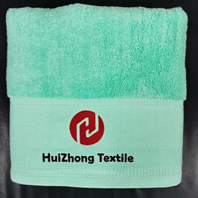 China Quick custom hotel 100% bath towels/spa/compressed wholesale suction embroidery logo cotton bathroom towels for women for sale