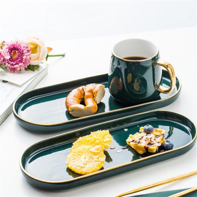 China Sustainable Wholesale Fancy Green Gold Handle Ceramic Coffee Mugs With Oval Dish for sale