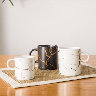 China Sustainable Bulk Custom Logo Stylish Black White Marble Coffee Mugs With Gold Intersperse for sale