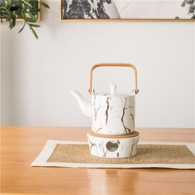 China Sustainable Luxury Wholesale White Marble Afternoon Tea Porcelain Teapot With Warmer for sale