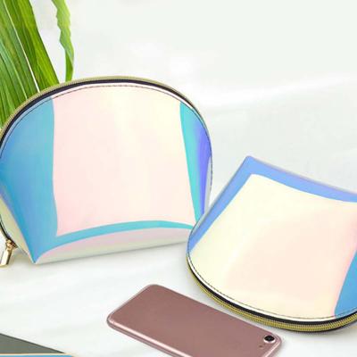 China Semicircular Custom Logo TPU Bag Water Resistant Laser Symphony Clutch Zipper Cosmetic Makeup Bag for sale