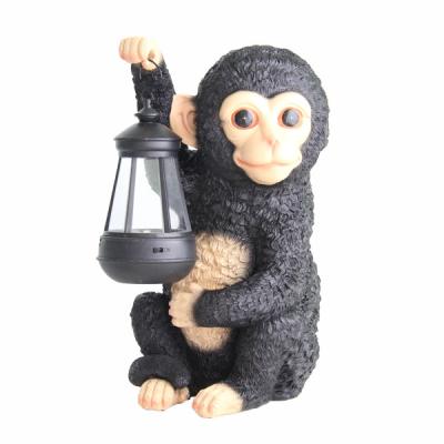 China Europe garden decoration resin monkey with handel solar light garden animal figurine for sale