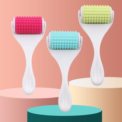 China Wholesale Manual Anti-Puffiness Silicone Face and Neck Roller Anti-puffiness Silicone Massage Facial Roller for sale