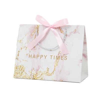 China Recycled Materials Wholesale Custom Printed Logo Luxury White Paper Bag Retail Boutique Shopping Gift Paper Bags With Your Own Logo for sale