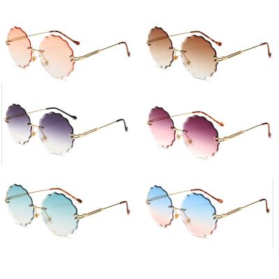 China Fashion Sun Glasses Women's Fashion Sunglasses Flower Round Rimless Sun Glasses Sunglasses for sale