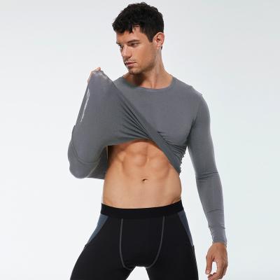 China Solid Color Men's Fitness Breathable Sports PRO Running Tight T-shirt Elastic Sweat Wicking Quick Dry Long Sleeved Shirt for sale