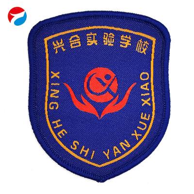 China Viable Factory Custom Cheap School Logo Printing Number Hot Melt Glue Woven Label Pin for sale