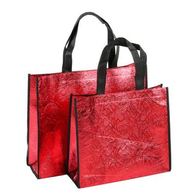 China Recyclable Hot Silver Nonwoven Laser Bag Clothing Bag Portable Advertising Shopping Bag for sale