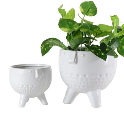 China Planter Small Bright White Green Balcony Garden Flower Pot Minimalist Ceramic Funny Smiling Succulent Plant Face Style Chandelier Decorations for sale