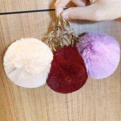 China Wholesale Cute Doll Key Chain Faux Fur Pom Pom Key Chain With 8cm Diameter Fake Fur Factory Price Shenzhen Lily Cheng for sale