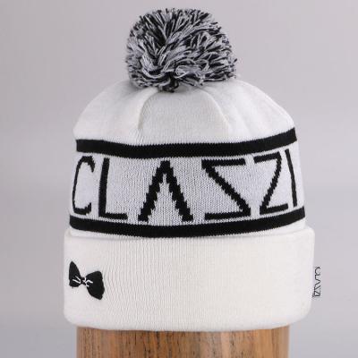 China JOINT Wholesale Cheap Custom Girls Knitted Hats Winter Pom Pom 100% Acrylic Beanies for sale