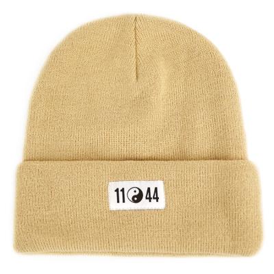 China Winter COMMON hengxing warm men knitted custom woven label logo beanie hats for sale