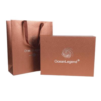 China Recycled Materials Wholesale Custom Printed Luxury Paper Stain Gift Bag Packaging Shopping Bags With Logos for sale