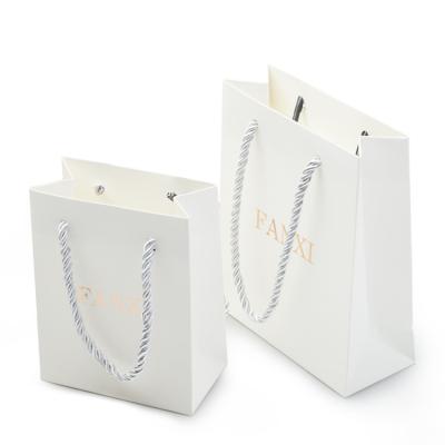 China Recycled White Luxury Paper Bag Jewelry Packaging Bag Luxury Materials Logo Gift Bags For Jewelry for sale