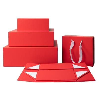 China Logo Disposable Stock Custom Folding Paper Apparel Cosmetic Wig Packaging Boxes Red Gift Box With Ribbon for sale