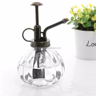 China Home Using Hand Watering Can Glass Spray Bottle With Metal Copper Top Pump For Garden Use Colorful Pumpkin Shape Design for sale