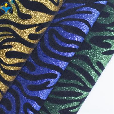 China Anti-mildew Backing 0.7mm Eco-friendly Woven Material PU Flocking Zebra Glitter Leather Fabric for sale