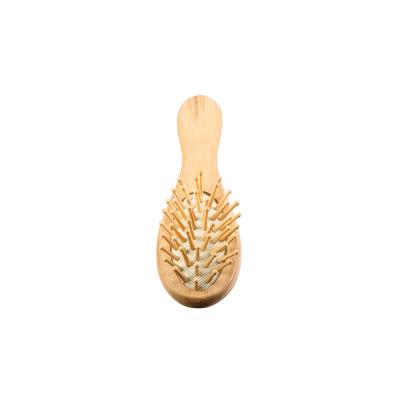 China Hot-selling Natural Wood Cushion Paddle Brush Eco-friendly Oval Shape Air Cushion Rubber Hair Brush for sale