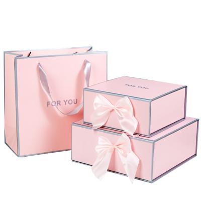 China Recycled Materials Customize Ribbon Gift Box Pink Paper Box With Paper Bag Flip Paper Boxes for sale