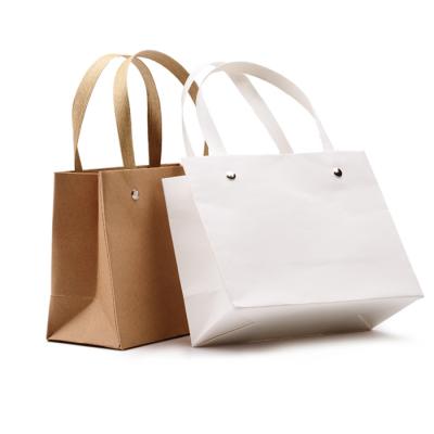 China Biodegradable Logo Shopping Paper Bag Custom Kraft Paper Bag Boutique Bags With Handle for sale