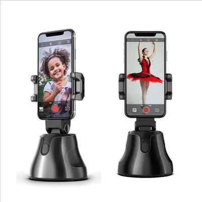 China Automatic Adjustable Portable 360 ​​Rotation Face Tracking Mobile Phone Holder Selfie Stick Tripod Stand for sale