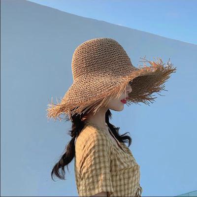 China Handmade Soft Folding Ladies Fashion Beach Travel Straw Bucket Hat Tassel Summer Sun Visor Striped Female Hat Wholesale for sale