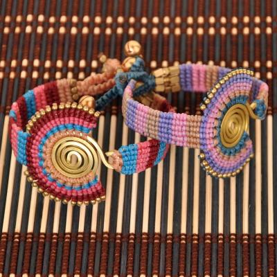 China Vintage Leather Rope Chain Brass Jingle Bell Charms Bracelet Woven Pattern Braided Rope Style Boho Women Southeast Asian Chain Bracelet for sale