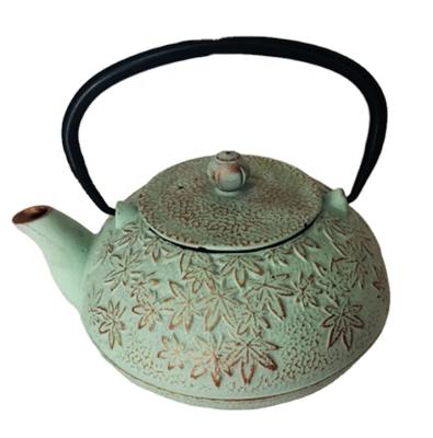 China 1.2L Maple Leaf Cast Iron Porcelain Enamel Sustainable Tea Kettle with Stainless Steel Strainer for sale