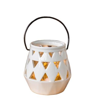 China Eco-friendly Design Modern Outdoor Decorative Portable Hollow Garden Decor Lighting Ceramic Lantern for sale