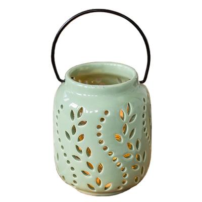 China Eco-friendly Design Modern Outdoor Decorative Portable Hollow Garden Decor Lighting Ceramic Lantern for sale