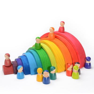 China Intelligence developing children's solid wood rainbow building block 12 color arched building block kindergarten puzzle early education stacked high for sale