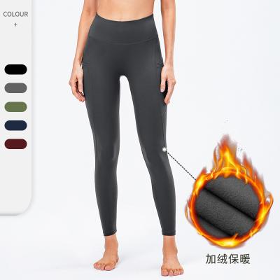 China Sustainable Yoga Pants With Side Pockets High Quality For Sporty Winter Fitness Sport Workout Running Heavily Waisted Yoga Leggings for sale