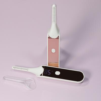 China Mini Plastic Beauty Tools Electric Heated Eyelash Curler for sale