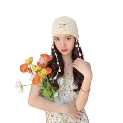 China COMMON Warm Tour Brim Crochet Knitted Hat Handmade Crochet Knit Winter Floral Hats For Women Flower Design Hollow Beanie Hat Women for sale